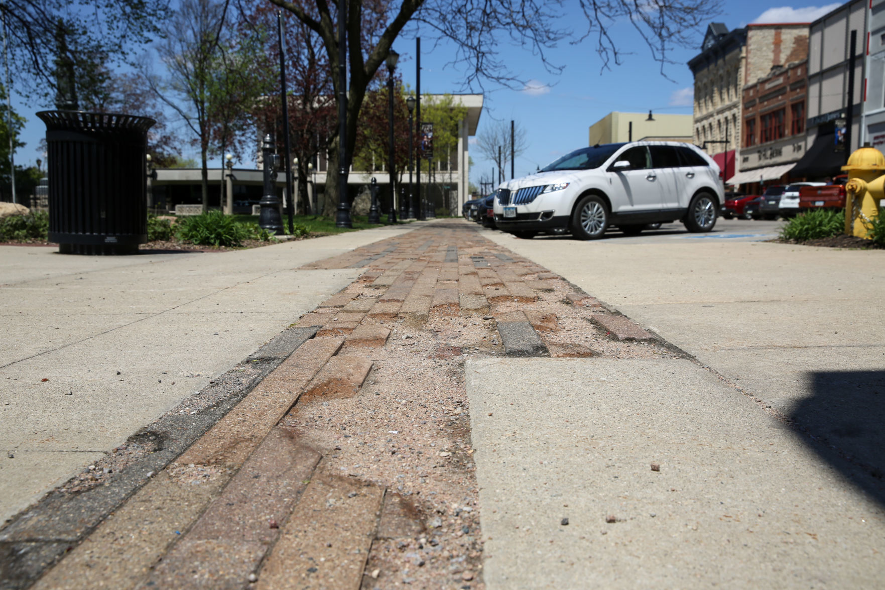 Crumbling bricks in the sidewalk on Federal Avenue